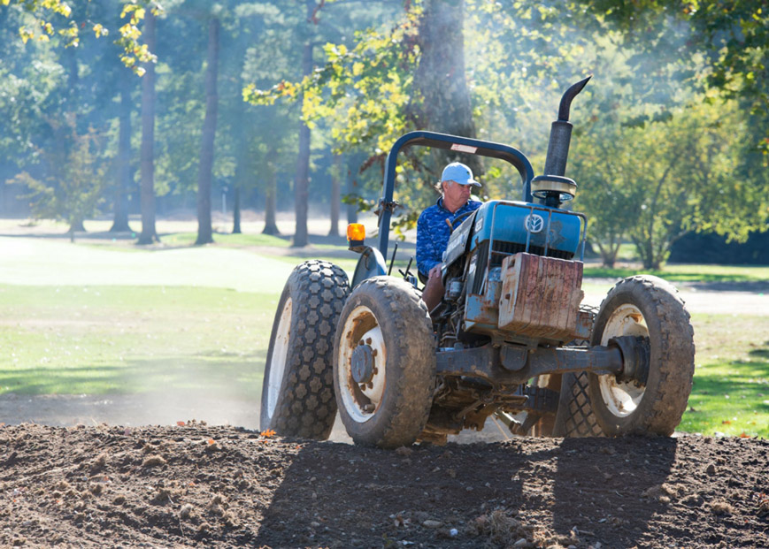 Bobby Weed on a tractor at the Cobblestone Creek Country Club Green Acres Golf Course demonstrating his hands-on approach to course design.