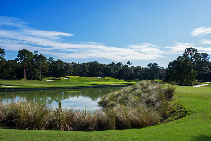 Challenging approach shot over water at Hilton Head National Golf Club in Bluffton, SC, designed by Bobby Weed and Gary Player
